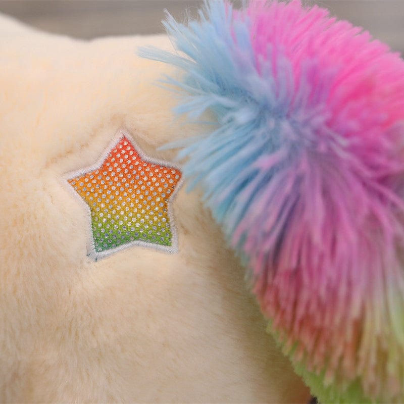 Peluche licorne avec des étoiles dans les yeux