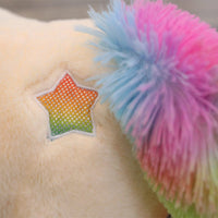 Peluche licorne avec des étoiles dans les yeux