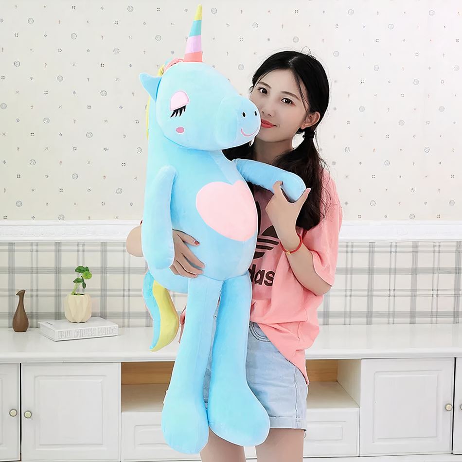 Peluche licorne XXL arc-en-ciel douce câline enfant 140cm / bleu La compagnie de la peluche