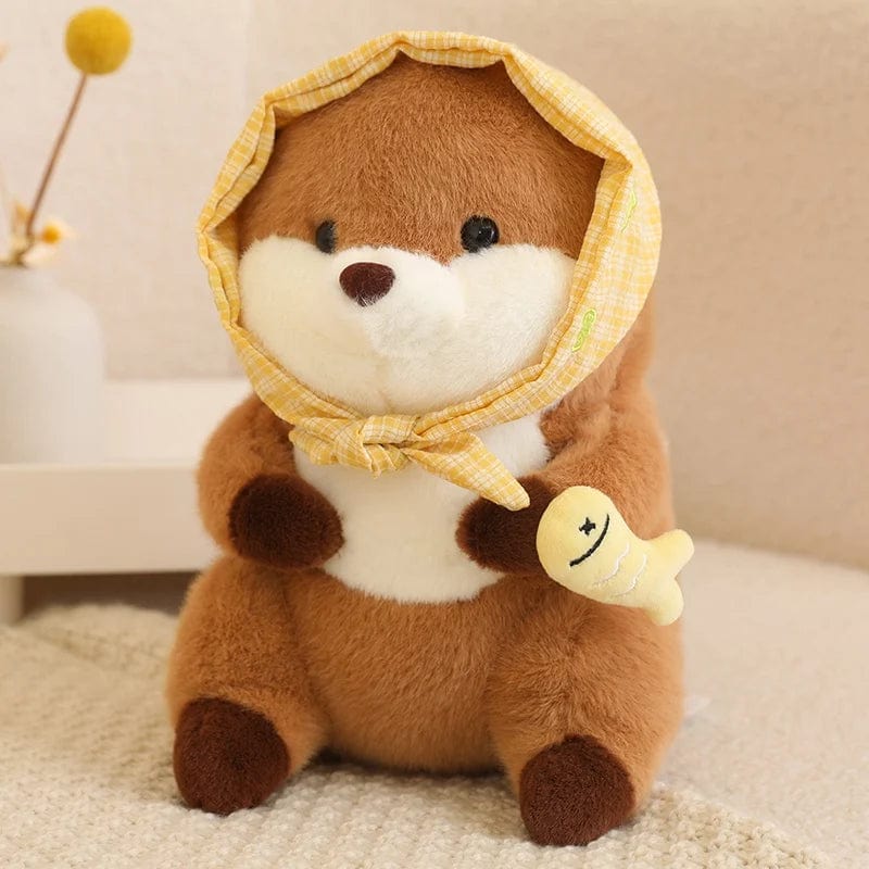Peluche loutre avec un voile qui tient un poisson coloré Jaune