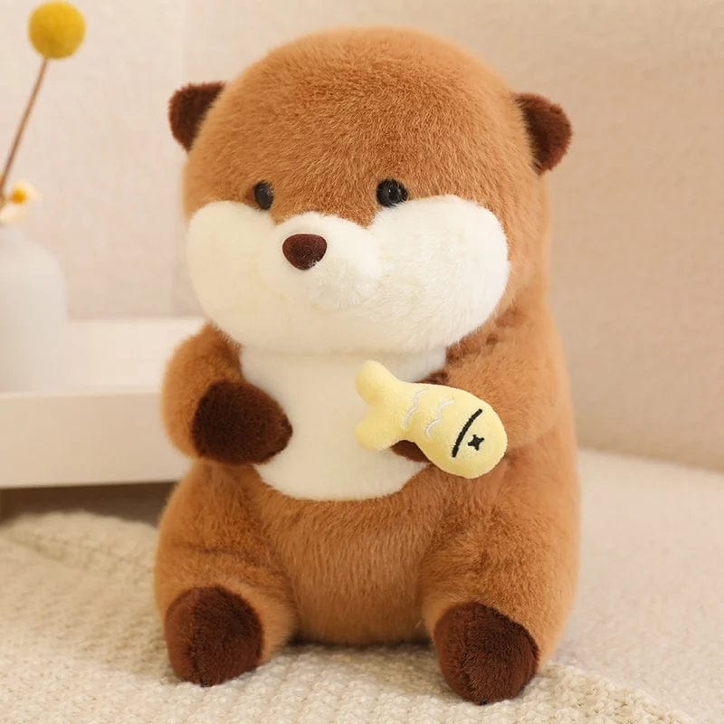 Peluche loutre qui tient un poisson coloré Jaune
