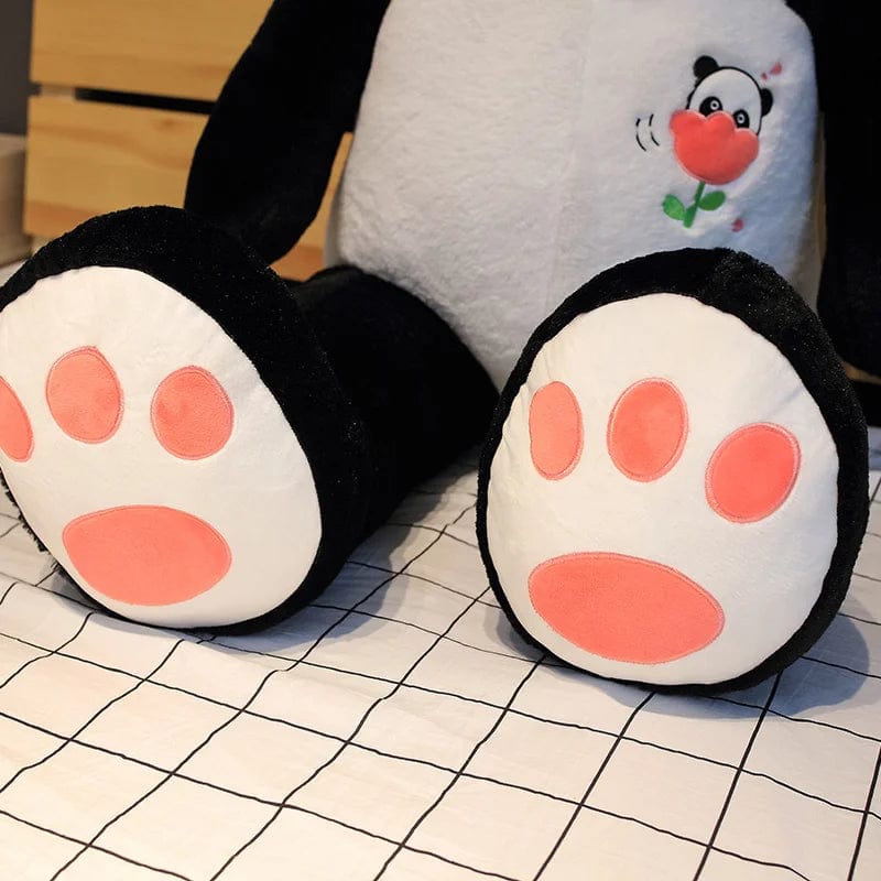 Peluche panda géant avec une fleur