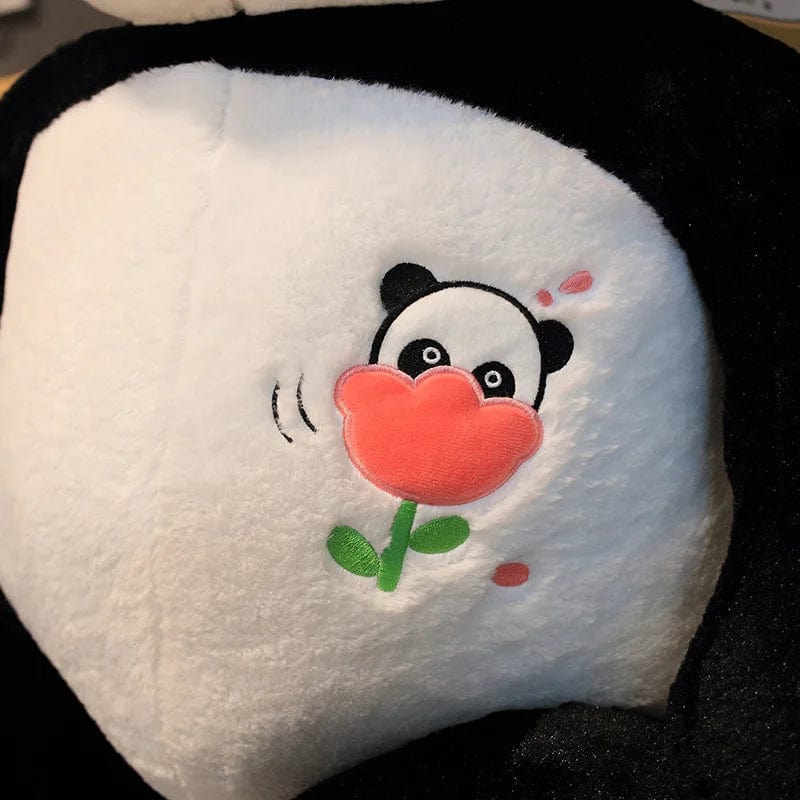 Peluche panda géant avec une fleur