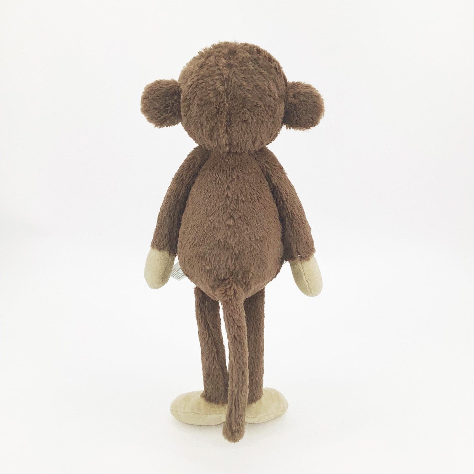 Peluche singe curieuse et attachante