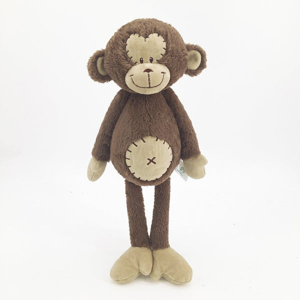 Peluche singe curieuse et attachante