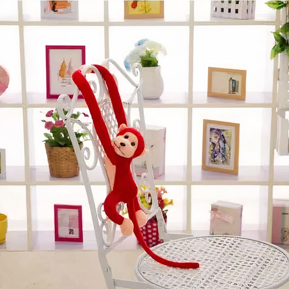 Peluche singe kawaii douce avec longue queue rouge La compagnie de la peluche