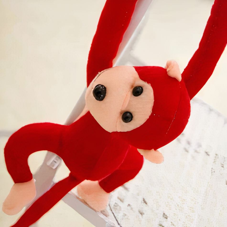 Peluche singe kawaii douce avec longue queue rouge La compagnie de la peluche