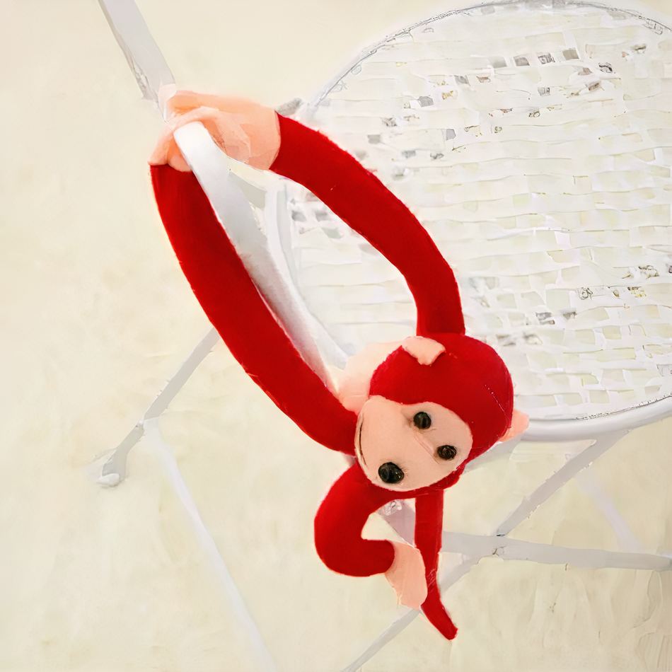 Peluche singe kawaii douce avec longue queue rouge La compagnie de la peluche