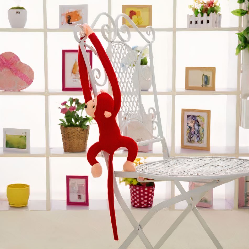 Peluche singe kawaii douce avec longue queue rouge La compagnie de la peluche