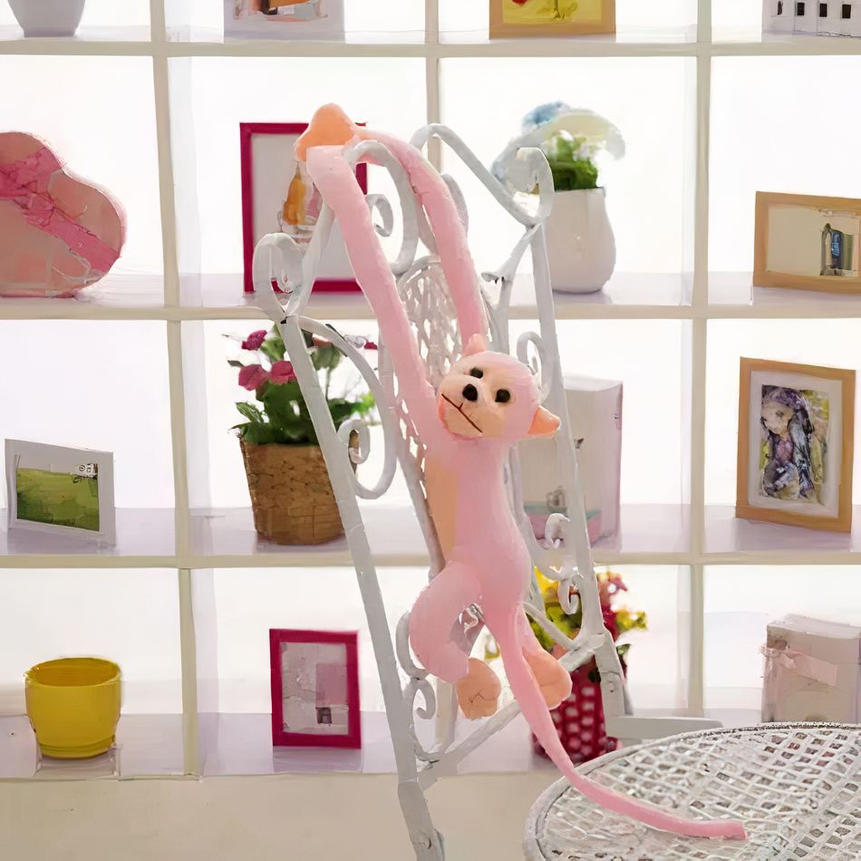 Peluche singe kawaii rose tendre longue queue douce La compagnie de la peluche