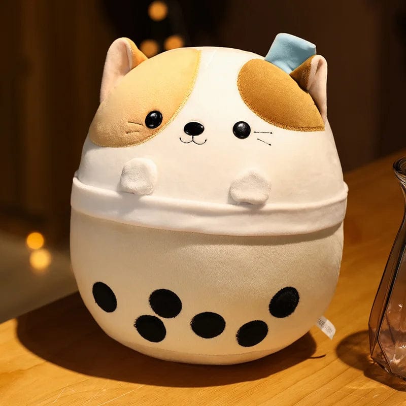 Peluche squishmallow chat dans un bol