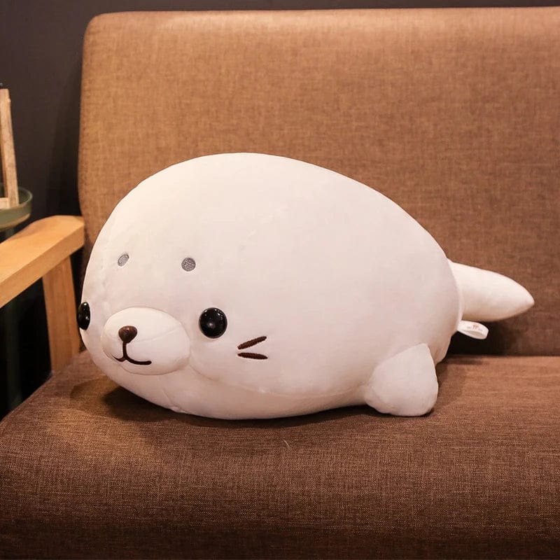 Peluche Squishmallow phoque blanc content
