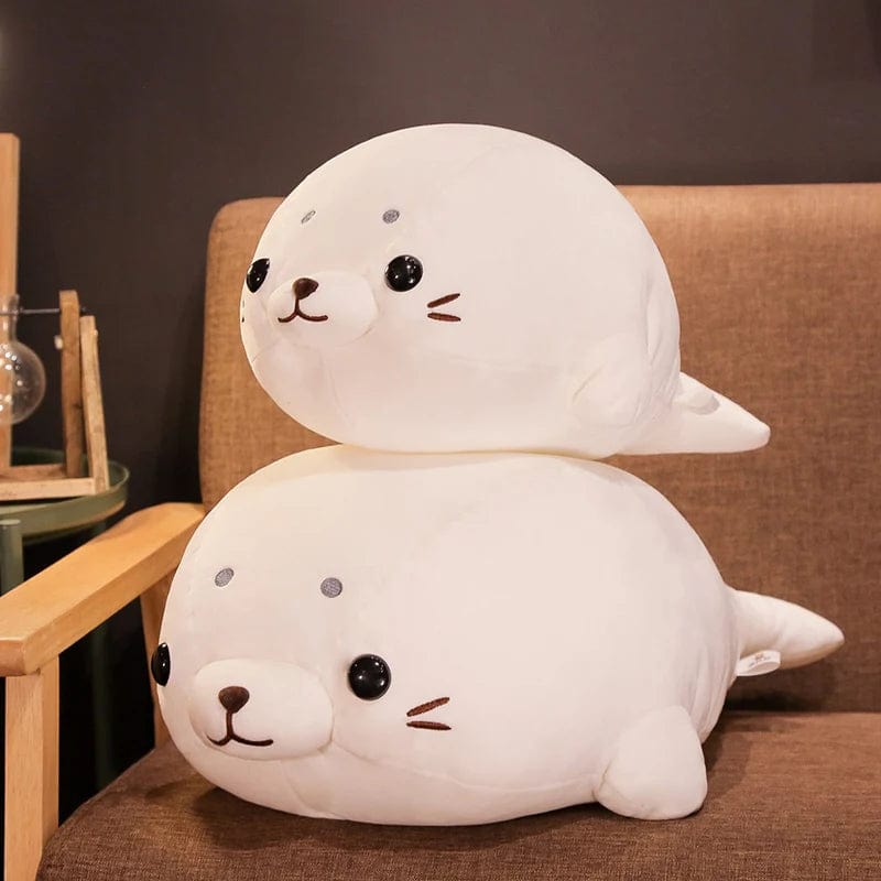 Peluche Squishmallow phoque blanc content