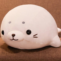 Peluche Squishmallow phoque blanc content