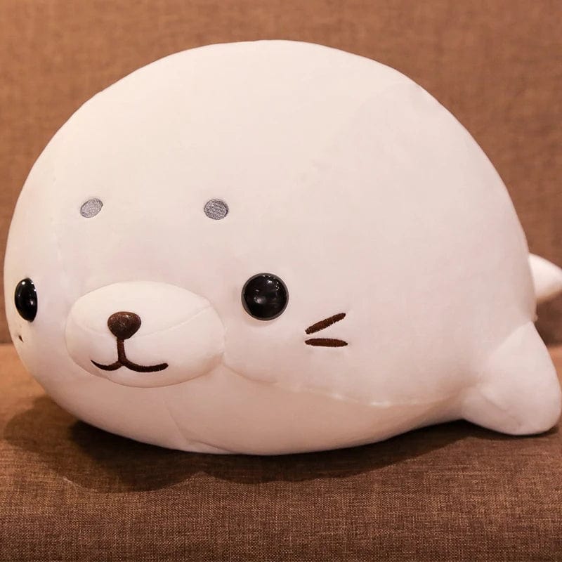 Peluche Squishmallow phoque blanc content