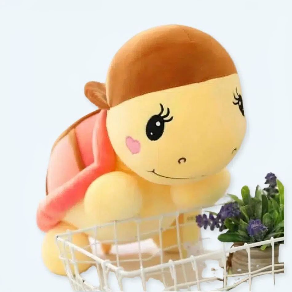 Peluche tortue rose câline avec casquette amusante 25cm La compagnie de la peluche