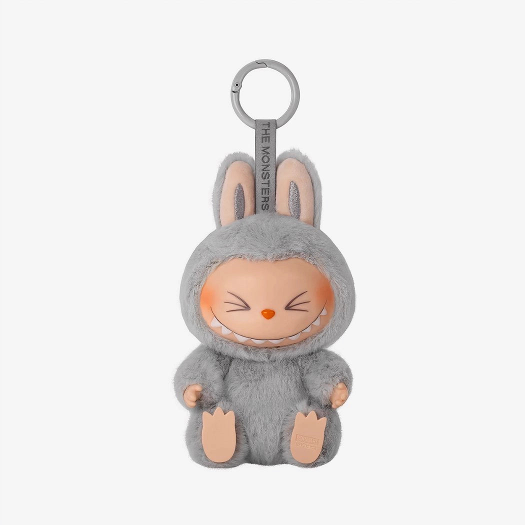 Peluche type Labubu assise boîte mystère