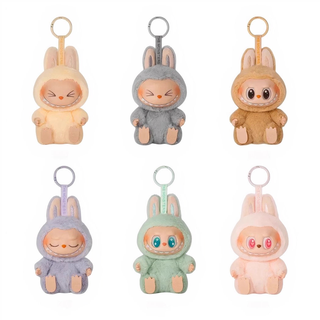 Peluche type Labubu assise boîte mystère